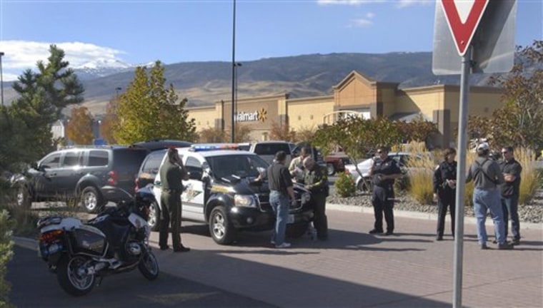 Police set up a command center Friday outside the Fire Creek Crossing Walmart in south Reno, Nev., where a gunman was holed up for hours after shooting three co-workers, authorities said.